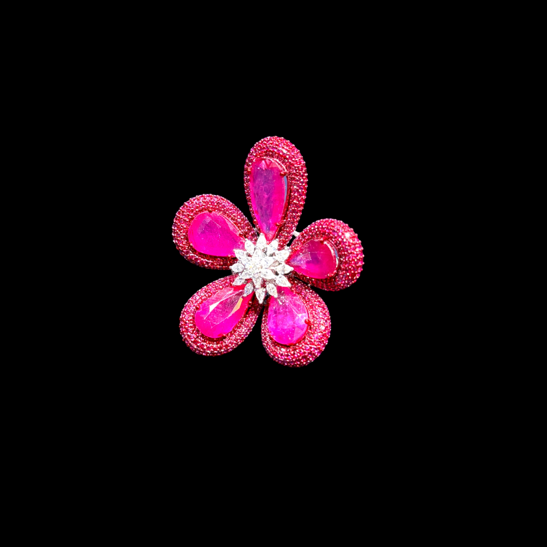 Corolla precious coloured gemstone ring by Abhushan Diamonds & Gold featuring vivid pink floral petals surrounding a brilliant diamond centre.