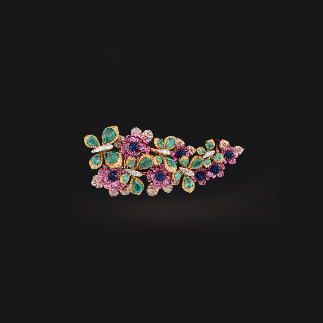 Sweet Pea Papilloré ring by Charu Jewels featuring colourful flowers, butterflies and green and pink gemstones.
