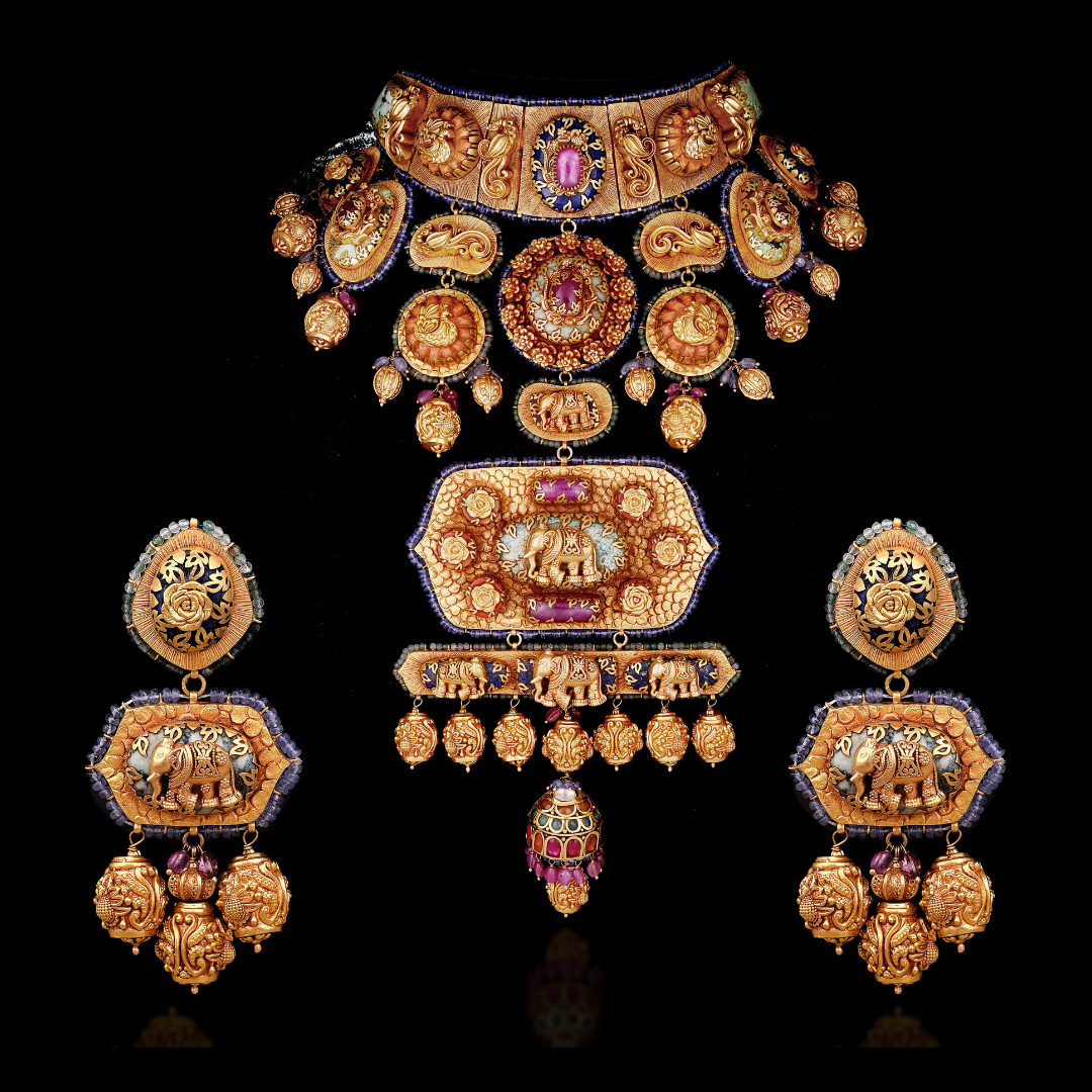 Gajagamini antique studded gold bridal jewellery set by Khurana Jewellery House featuring elephant motifs, floral detailing and coloured gemstone accents.