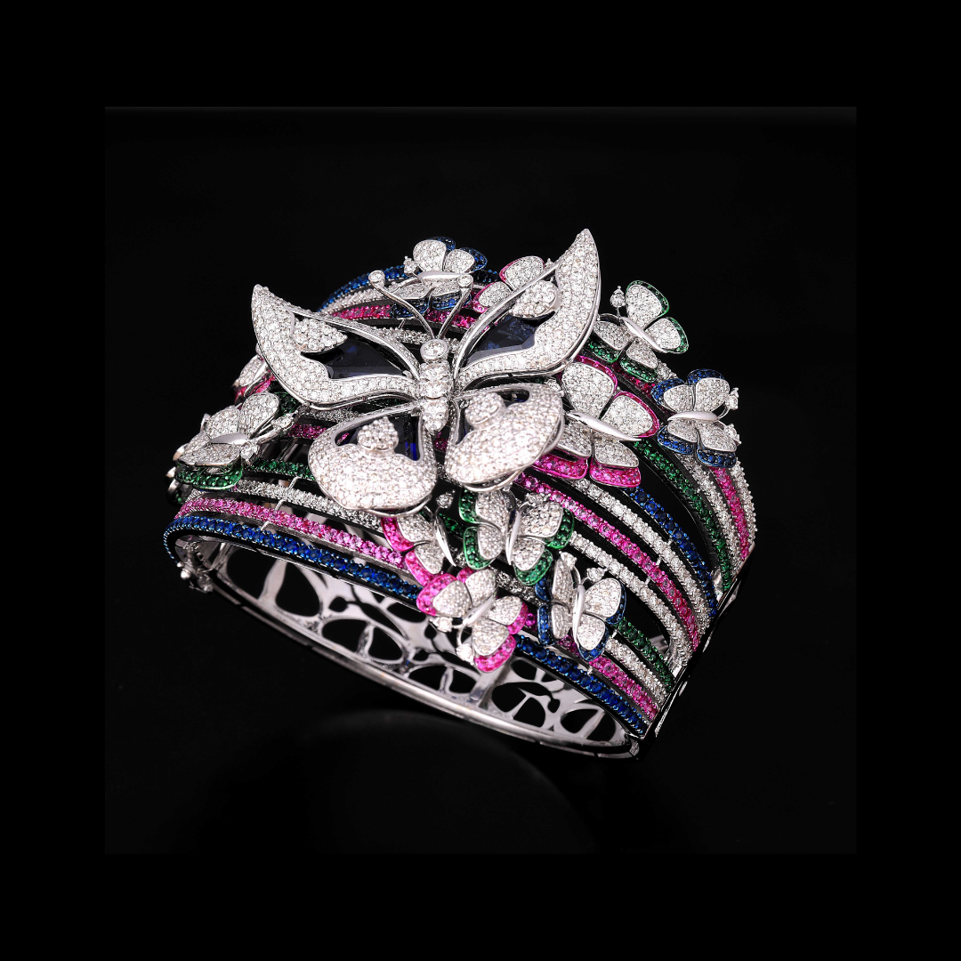 The Artist’s Garden coloured gemstone bracelet by Khurana Jewellery House featuring butterflies, floral motifs and vivid gemstone accents.
