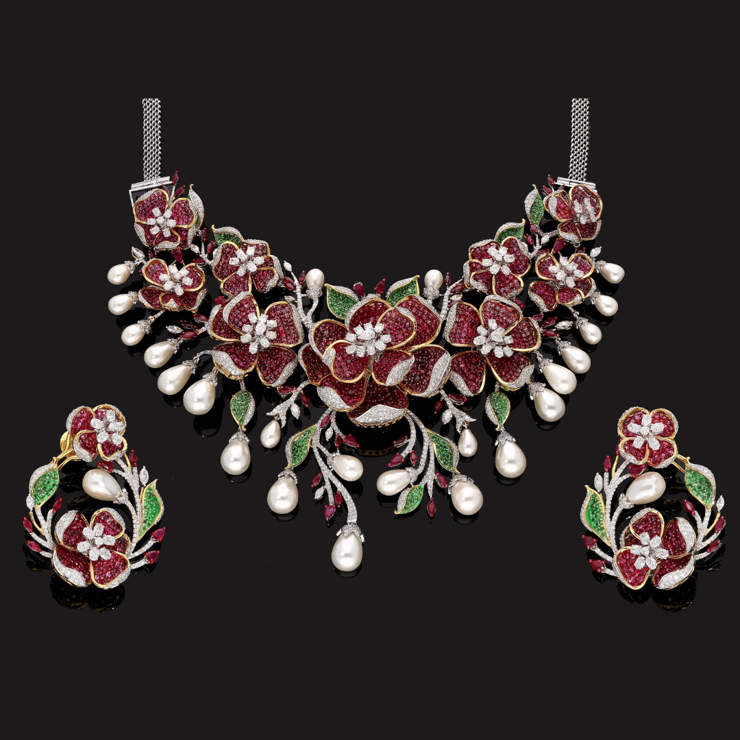 Vows in Bloom precious coloured gemstone bridal necklace and earrings by Kashi Jewellers with floral motifs and pearl drops.