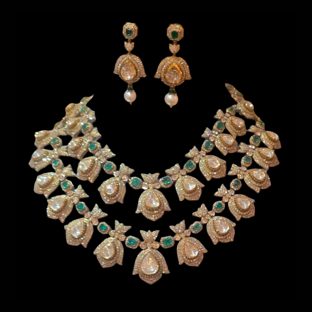Mahesh Notandas Jewellers Where the Lotus Rests bridal Polki necklace and earrings with lotus motifs and green gemstone accents. 