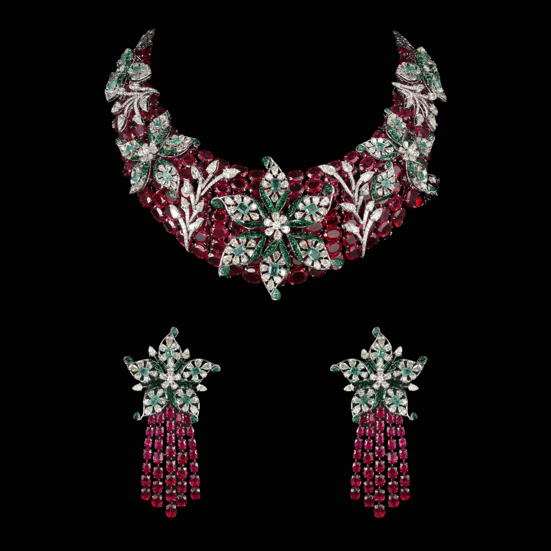 Luminous Night precious coloured gemstone bridal necklace and earrings by Manubhai Jewellers in red, green and white floral motifs.