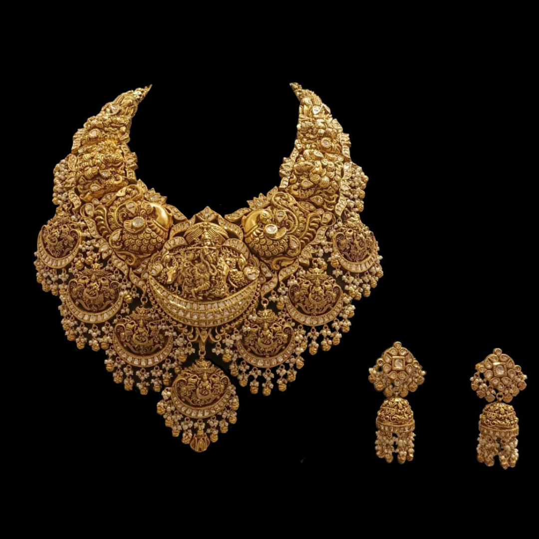 The Echoes of Devotion antique gold bridal necklace and earrings by Mehta Emporium Jewellers with sacred deity and sculpted floral motifs.