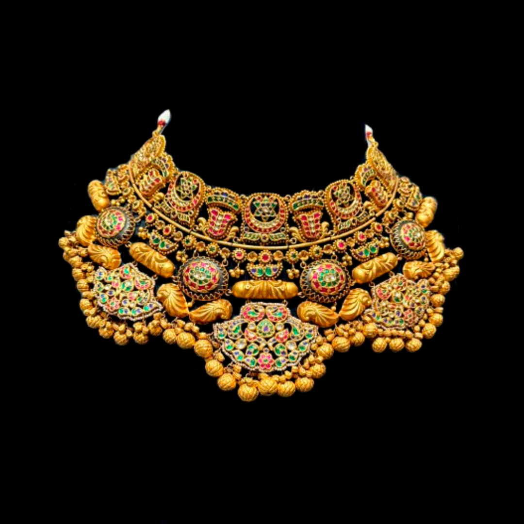 Mahotsava antique studded gold bridal necklace and earrings by Punjabi Saraf Jewellers with colourful stonework and intricate traditional motifs.
