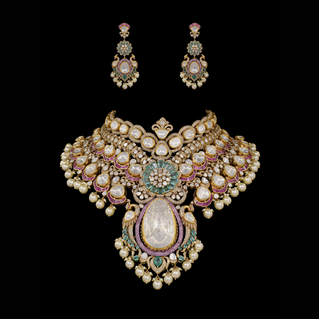 Raniwala Jewellers Guardians of Light bridal Polki necklace and earrings with peacock details, pearls and green and pink accents. 