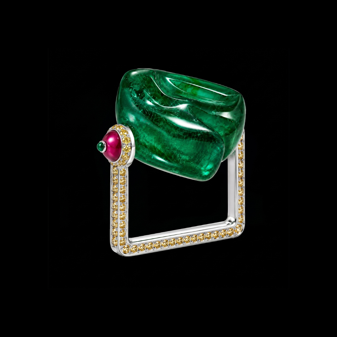 Nature Framed precious coloured gemstone ring by Symetree by Haritsons Designs featuring a sculptural green gemstone in a geometric diamond-set frame.