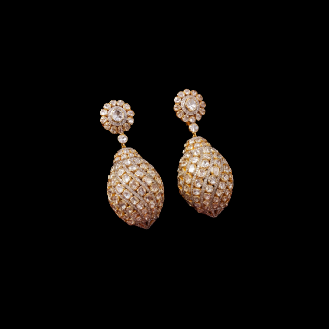 DC Jewellers Mukula Polki earrings featuring sculptural oval drops set with uncut diamonds.
