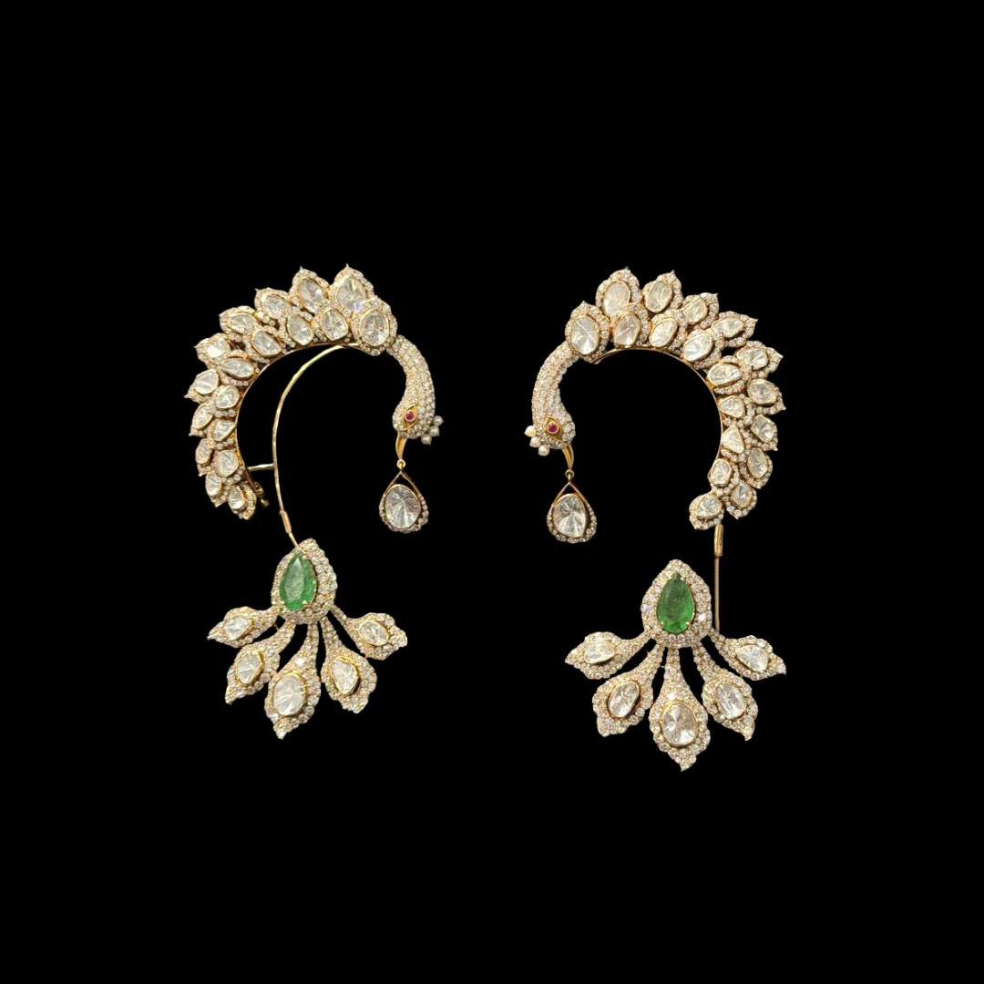 Frontier Jewellers The Panache Polki earrings featuring peacock-inspired motifs, uncut diamonds and green gemstone accents