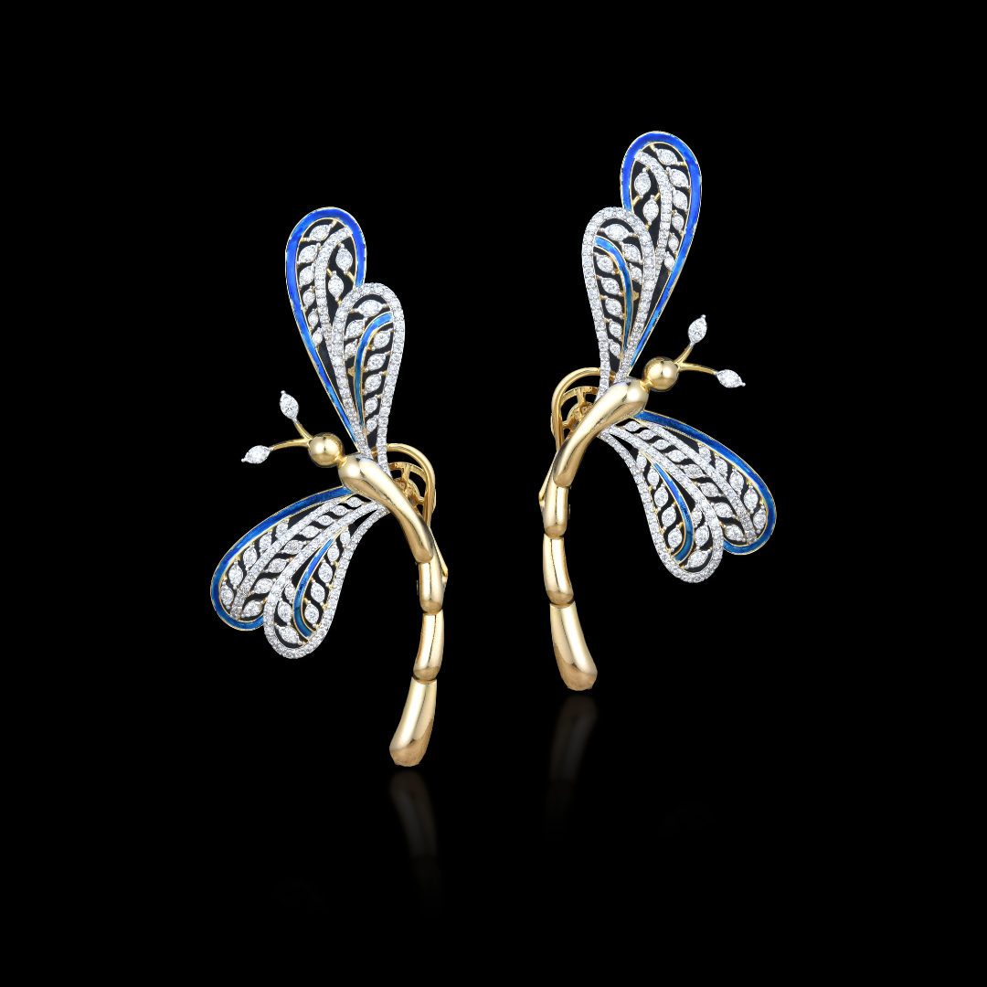 The Azure Waltz dragonfly earrings by Khurana Jewellery House featuring blue and white wing detailing with sculptural gold-toned stems. 