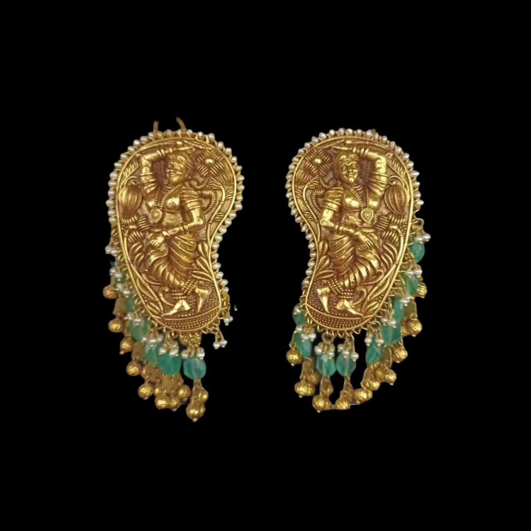 Mehta Emporium Jewellers Nritya gold earrings featuring sculpted deity motifs and emerald drop details 