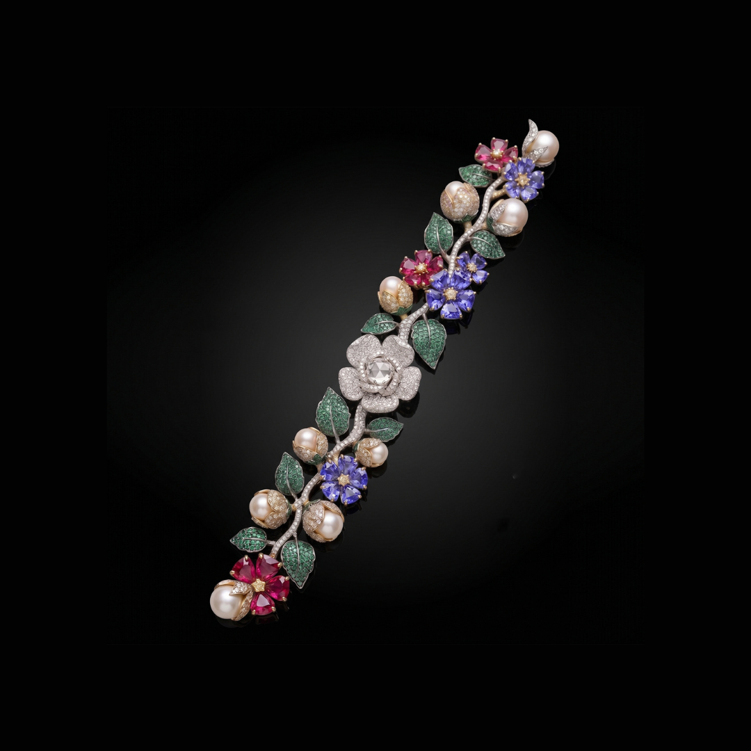 Symetree by Haritsons Designs Roseraie bracelet featuring floral motifs, pearls and precious coloured gemstones in purple, green and pink hues. 