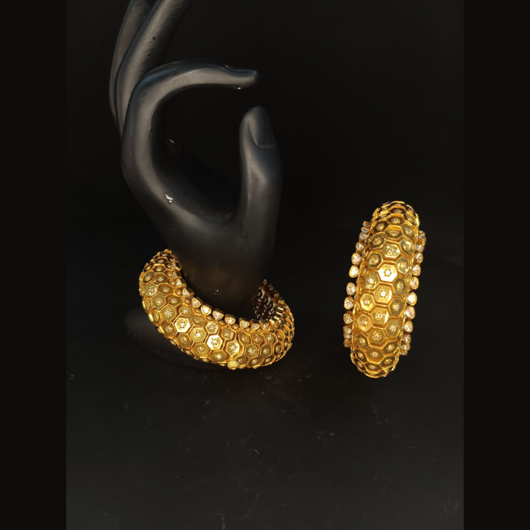Sumeet Jewellers The Golden Hive gold bangles featuring an intricate honeycomb-inspired hexagonal design